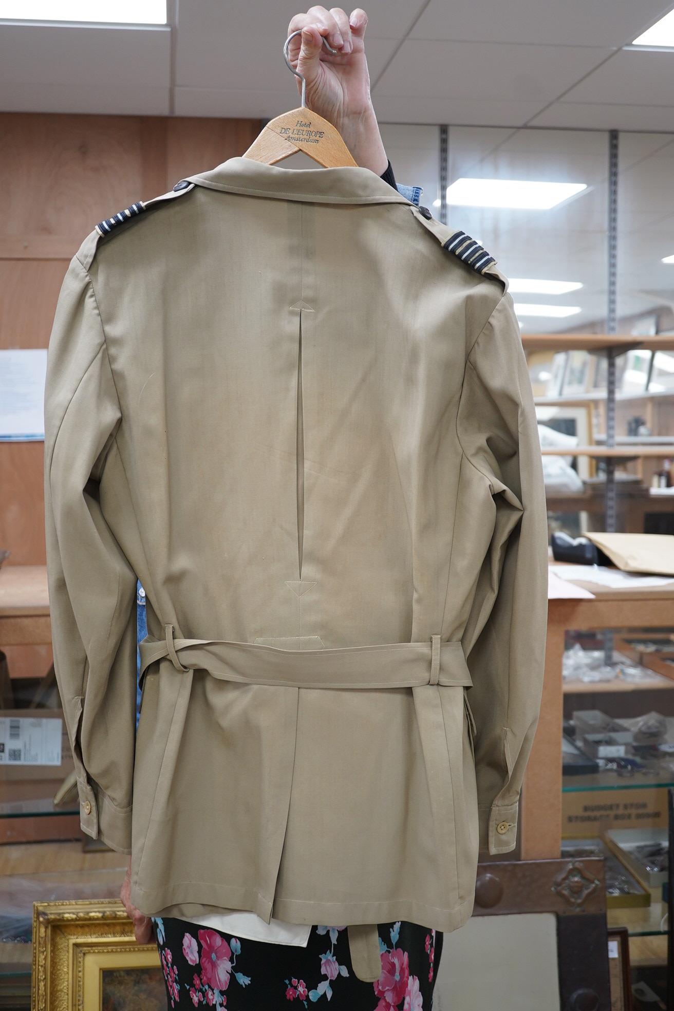 Two post-WWII RAF uniforms, one with applied medal ribbons, an RAF cap, and related buttons, together with a bowler hat and two Arab daggers. Condition - good